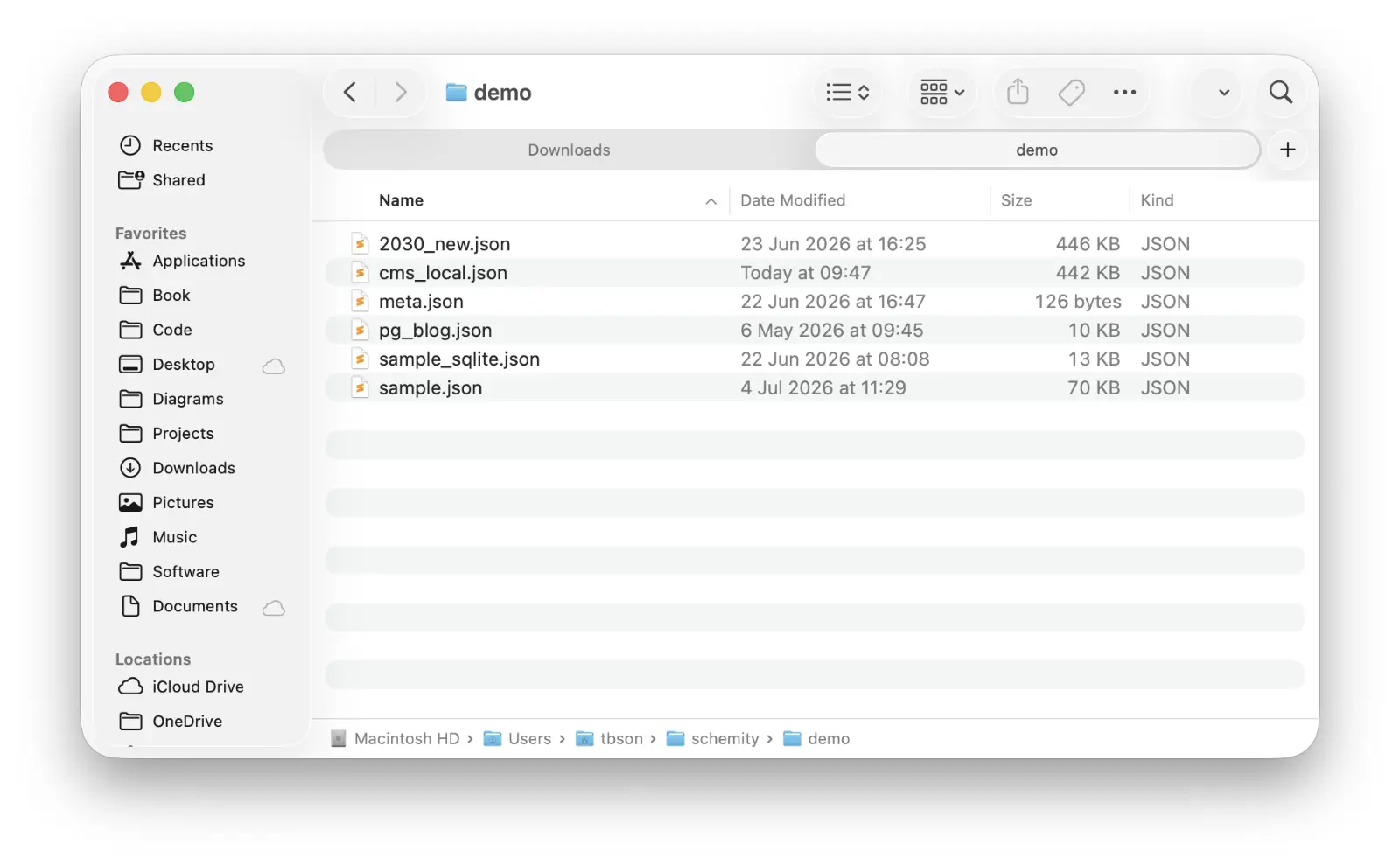 A Schemity workspace folder open in Finder: each diagram is a plain JSON file sitting under ~/schemity, visible like any other file